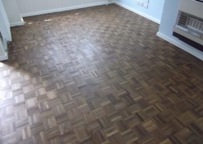Walnut parquet flooring.